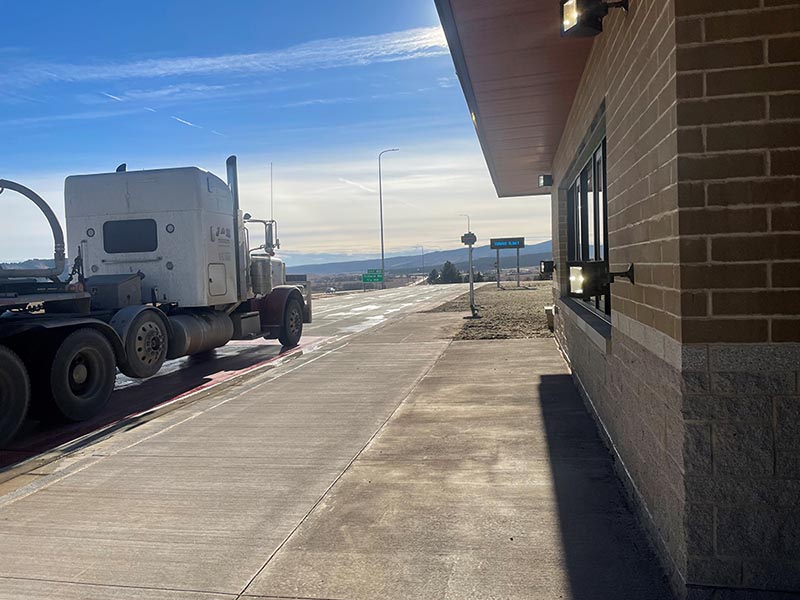 As trucks approach the scales, they are electronically pre-screened and released or sent to a drive-through bay for further inspection.